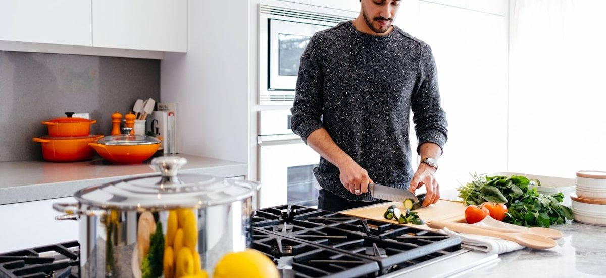 man cutting vegetables