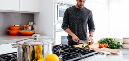 man cutting vegetables